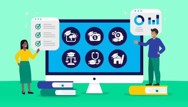 two students standing next to a large computer screen