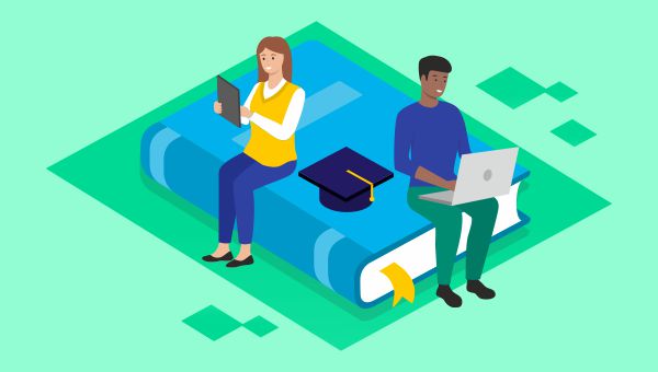 Two students sitting on a book looking at their devices.